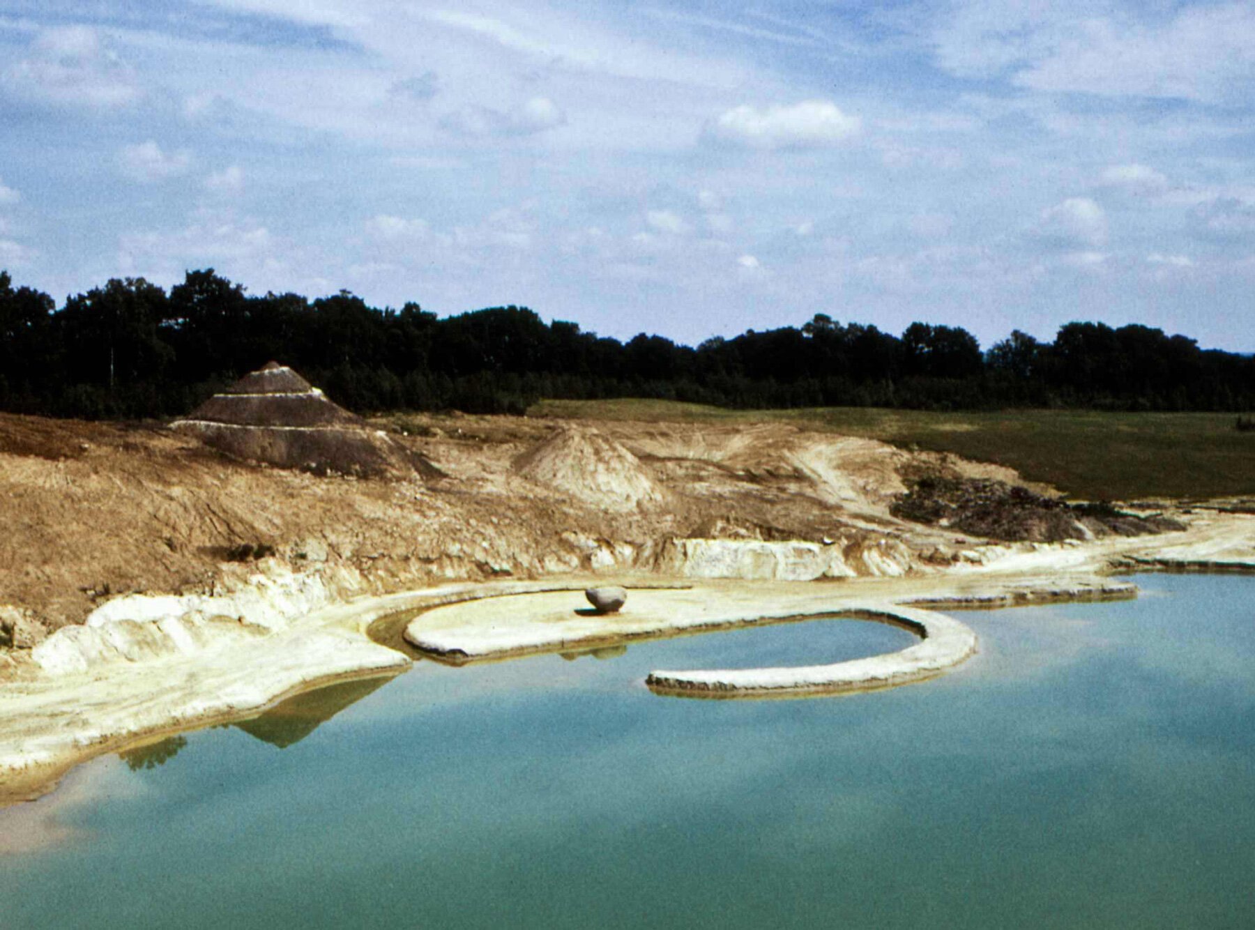 robert-smithson-broken-circle-spiral-hill-former-sand-mine-netherlands-earthwork-designboom-large-1